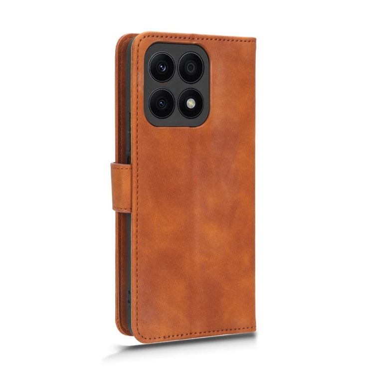 For Honor X8a Skin Feel Magnetic Flip Leather Phone Case(Brown) - Honor Cases by PMC Jewellery | Online Shopping South Africa | PMC Jewellery